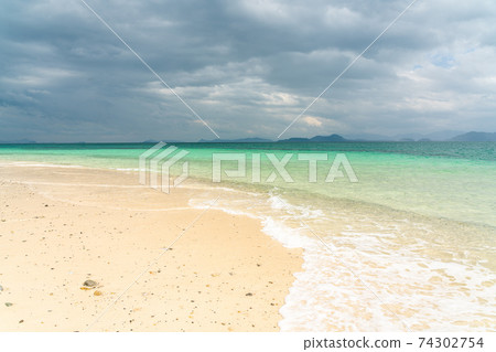 White sand beach in khang khao island, Ranong, Thailand in cloudy day. 74302754