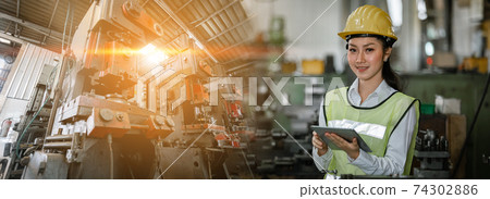 Asian woman engineer industry double exposure at machine area. 74302886