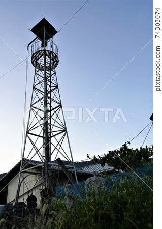 A half bell on the fire lookout tower that convenes a rural fire brigade A half bell on the fire lookout tower that convenes a rural fire brigade 74303074