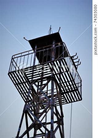 A half bell on the fire lookout tower that convenes a rural fire brigade A half bell on the fire lookout tower that convenes a rural fire brigade 74303080