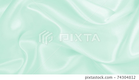 Smooth elegant green silk or satin luxury cloth texture as abstract background. Luxurious background design Smooth elegant green silk or satin luxury cloth texture as abstract background. Luxurious background design 74304812
