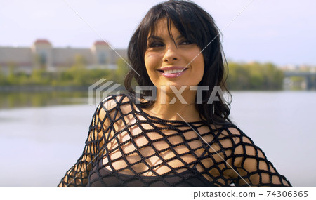 Portrait of a beautiful flirty woman Portrait of a beautiful flirty woman 74306365