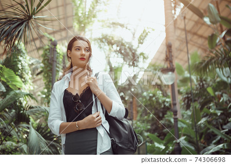 Tourist Woman in the Train Station with Jungles Indoors. 74306698