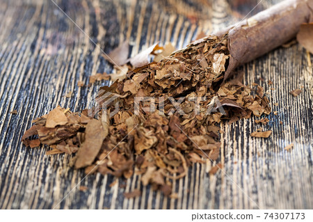 tobacco from a crumbling cigarette tobacco from a crumbling cigarette 74307173