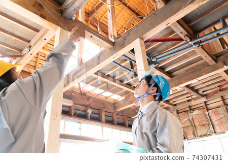 People working at a residential construction site Skeleton remodeling meeting Ceiling 74307431
