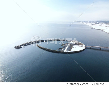 Aerial view of the snow scene of Kunnui Fishing Port in Oshamambe Town, Hokkaido in winter 74307849