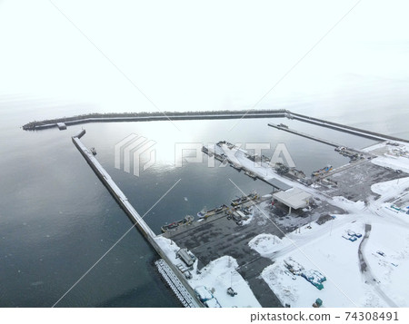 Aerial view of snow scene at Daichu fishing port in Oshamambe-cho, Hokkaido in winter 74308491