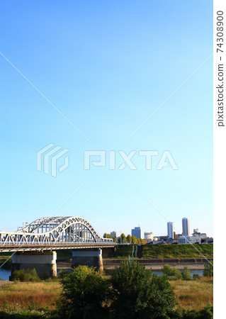 Scenery of Chusetsubashi Bridge over the Nagara River and the skyscrapers in front of Gifu Station in Gifu City Scenery of Chusetsubashi Bridge over the Nagara River and the skyscrapers in front of Gifu Station in Gifu City 74308900