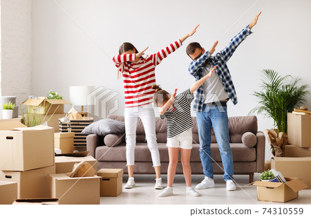 Family dabbing in new apartment 74310559