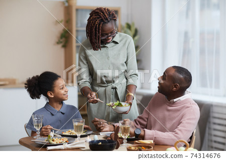 Modern African American Family Enjoying Breakfast at Home Modern African American Family Enjoying Breakfast at Home 74314676