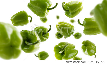 Green paprika levitates on a white background Green paprika levitates on a white background 74315158