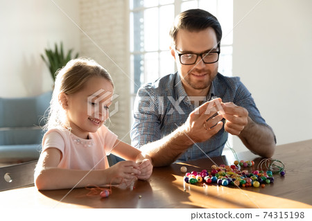 Happy dad play with cute small daughter Happy dad play with cute small daughter 74315198