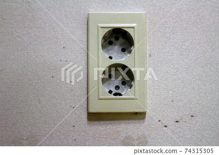 White Electrical Outlet and Wall Plate at the White Electrical Outlet and Wall Plate at the 74315305