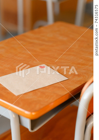 Letter placed on the desk 74316575