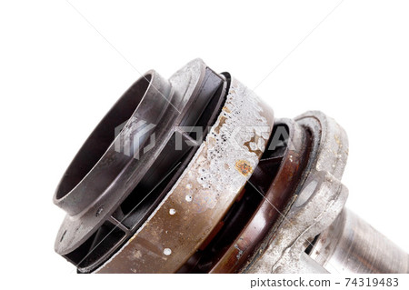 Corrosion and sinkholes on a spent car pump out of order, on a white background, isolate. 74319483