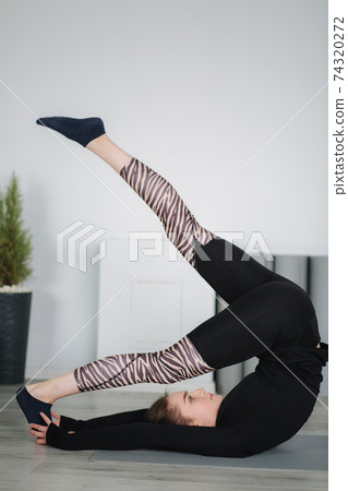 Young stretching master show differnt poses for stretch Young stretching master show differnt poses for stretch 74320272