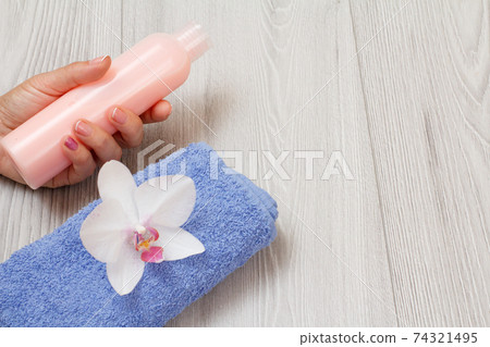 Women perfumers and cosmetics on a wooden background. Women perfumers and cosmetics on a wooden background. 74321495