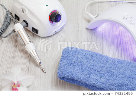 A set of cosmetic tools on a gray wooden background. A set of cosmetic tools on a gray wooden background. 74321496
