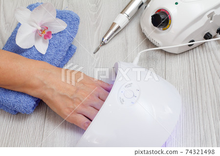 Set of cosmetic tools on a gray wooden background. 74321498