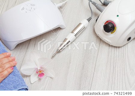 A set of cosmetic tools on a gray wooden background. 74321499