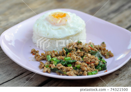 stir fried pork with holy basil and cow pea, fried egg and rice stir fried pork with holy basil and cow pea, fried egg and rice 74321500