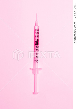 Medical syringe on a pink background. Health and vaccination concept. Cosmetology.Flat lay, copy space. Medical syringe on a pink background. Health and vaccination concept. Cosmetology.Flat lay, copy space. 74321780