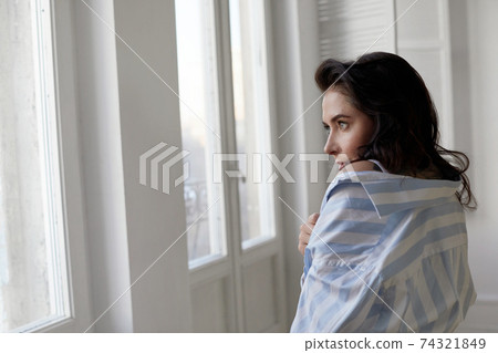 Tender woman in shirt at home 74321849