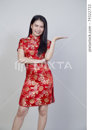 Asian woman wearing traditional cheongsam qipao Asian woman wearing traditional cheongsam qipao 74322733