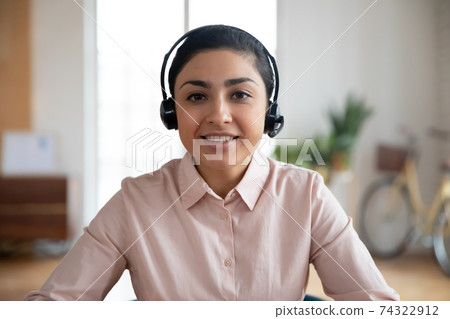 Happy teacher conducting online class from home 74322912