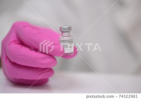 Romania, Galati, 08.02.2021 Pfizer and BioNTech Covid-19 vaccine. Small ampoules 74322981