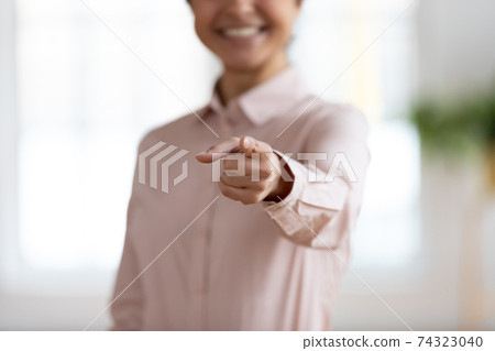 Hand of business woman pointing finger at camera 74323040