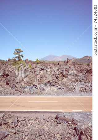 Scenic road through volcanic terrain, Tenerife, Spain. Scenic road through volcanic terrain, Tenerife, Spain. 74324083