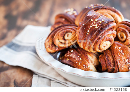 Homemade finnish cinnamon and cardamom rolls (buns) Homemade finnish cinnamon and cardamom rolls (buns) 74328168