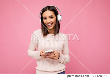 Photo shot of beautiful joyful smiling young female person wearing stylish casual outfit isolated 74328335