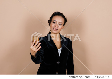 An isolated shot of a happy black businesswoman An isolated shot of a happy black businesswoman 74330083