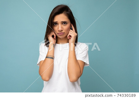 Portrait of sad sorrowful young pretty nice brunette woman with sincere emotions wearing casual 74330189