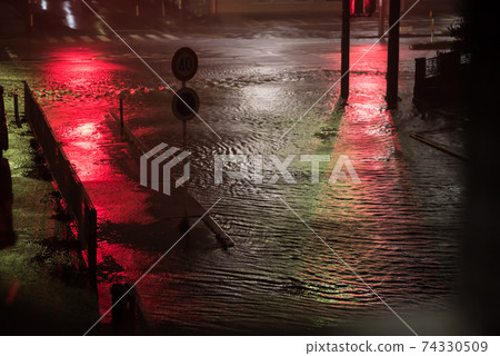 Roadway that is likely to be flooded by heavy rain 74330509