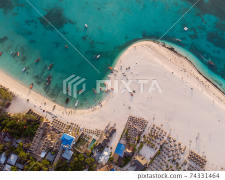 Aerial view of wooden fisherman boats anchored near Kendwa village, Zanzibar 74331464