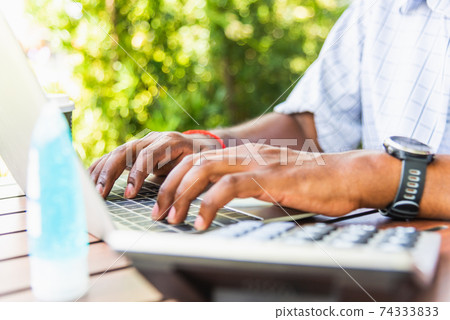 businessman sitting on desk work from home using laptop computer businessman sitting on desk work from home using laptop computer 74333833