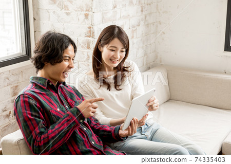 Young couple home time Young couple home time 74335403