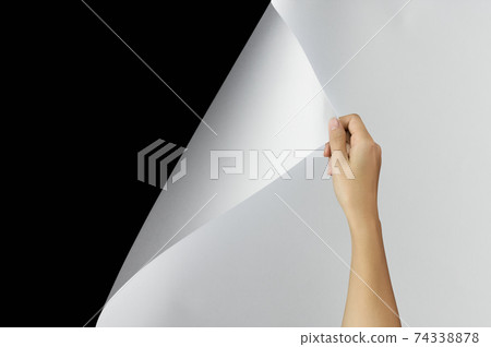 Woman hand turning page. 74338878