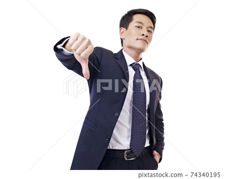businessman showing thumb-down sign, isolated on white 74340195