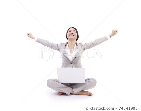 young woman with laptop computer celebrating success, isolated on white 74341993