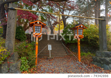 Fujiyoshida, Yamanashi, Japan - November 17, 2016- Autumn scene at entrance to Arakura Sengen Shrine, the path leading to the Chureito Pagoda 74342898
