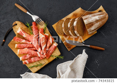 Overhead view of rolled slices of jamon Overhead view of rolled slices of jamon 74343815