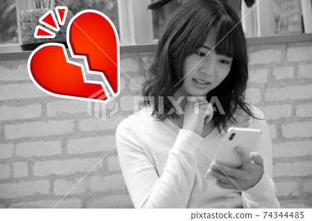 Image of a young woman with a broken heart Image of a young woman with a broken heart 74344485
