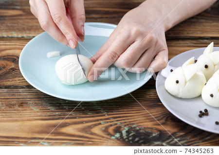 DIY instruction. Step by step guide. Making a funny rabbit from boiled eggs, decorating the Easter table, Easter decor and serving DIY instruction. Step by step guide. Making a funny rabbit from boiled eggs, decorating the Easter table, Easter decor and serving 74345263