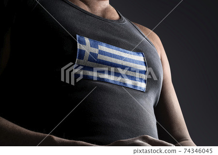 The national flag of Greece on the athlete's chest The national flag of Greece on the athlete's chest 74346045
