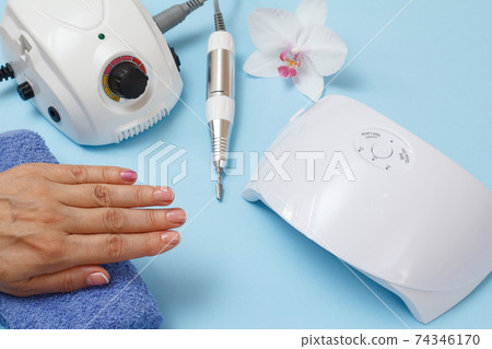 Set of cosmetic tools on a blue background. Set of cosmetic tools on a blue background. 74346170