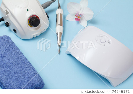 Set of cosmetic tools on a blue background. 74346171